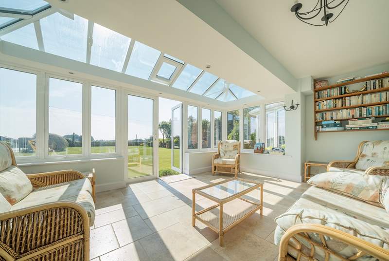 The conservatory is a real sun-trap and ideal for relaxing with views and access to the garden. 