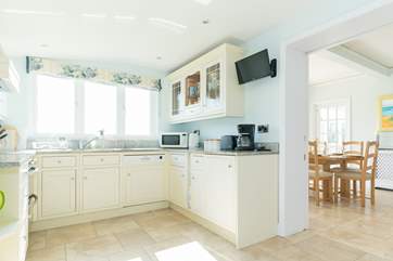 Enjoy cooking in this bright and modern kitchen which leads into the dining-room.