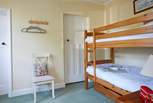 The third bedroom on the ground floor with bunk-beds and en suite shower-room.