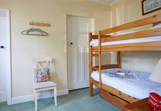 The third bedroom on the ground floor with bunk-beds and en suite shower-room.