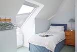 The twin bedroom on the first floor with lovely views of the garden and the sea out the Velux window.