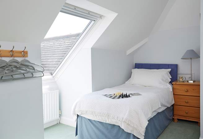 The twin bedroom on the first floor with lovely views of the garden and the sea out the Velux window.