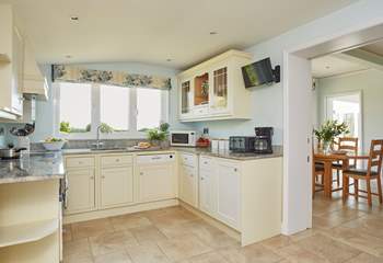 Enjoy cooking in this bright and modern kitchen which leads into the dining-room.