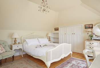 The master bedroom on the first floor, offers stunning sea views from the balcony. 