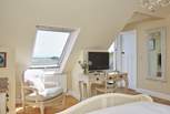 The main bedroom with wonderful views of the sea from the Velux window and the private balcony.