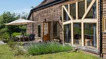 The outside seating area is a lovely spot for a barbecue.