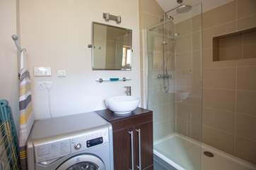 Downstairs shower-room with walk-in shower and washing machine/drier.