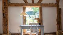 Writing desk with views to the garden and tennis court.