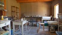 Book a pottery lesson in advance with the owner.