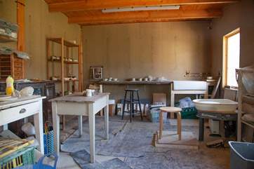 Book a pottery lesson in advance with the owner.