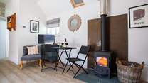 Relax by the cosy wood-burner.