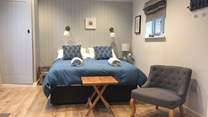 The open plan bedroom area with a comfortable large king-size double bed.