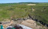 A view of Rinsey beach with the old Cornish engine house on the hill and the cottage in the middle to the left. - Thumbnail Image