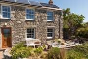 The sunny terrace to the front of the house is the place to be.