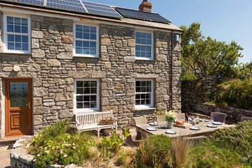The sunny terrace to the front of the house is the place to be.