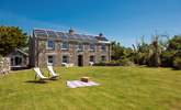 There is room to relax, play and kick a ball in the large lawned garden to the front of this pretty stone cottage. - Thumbnail Image