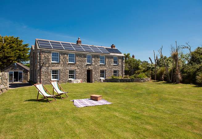 There is room to relax, play and kick a ball in the large lawned garden to the front of this pretty stone cottage.