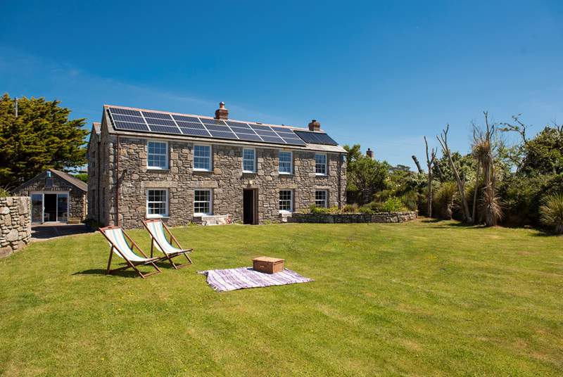 There is room to relax, play and kick a ball in the large lawned garden to the front of this pretty stone cottage.