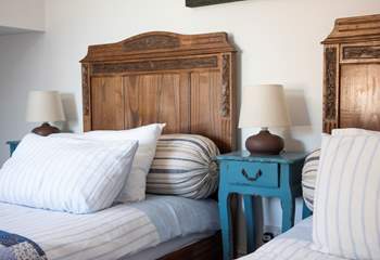 Gorgeous vintage twin beds feature in this bedroom.