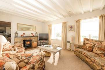 The sitting-room is a comfortable and stylish space to relax whatever time of year you stay.