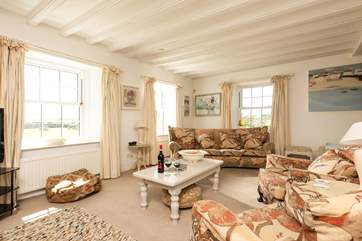 Room to spread out at one end with a good book or games and around the fire or the television at the other.