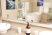 The main bathroom with a deep bath tub, perfect for sinking under the bubbles for some full on relaxation.