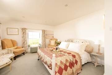 The beautiful master bedroom is a calm retreat, wake up to those wonderful views.