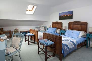 Antique beds in the spacious twin-room.