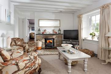 The sitting-room is a comfortable and stylish space to relax whatever time of year you stay.