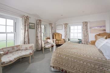 This fabulous main bedroom is triple aspect, so sea views times three!