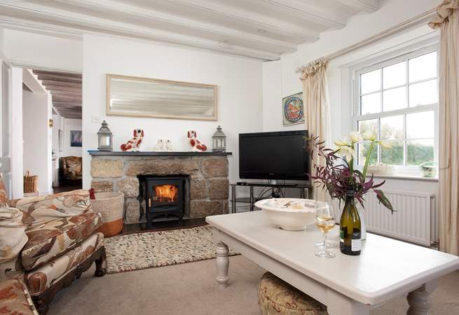 Lounge by the flickering flames of the wood-burner.