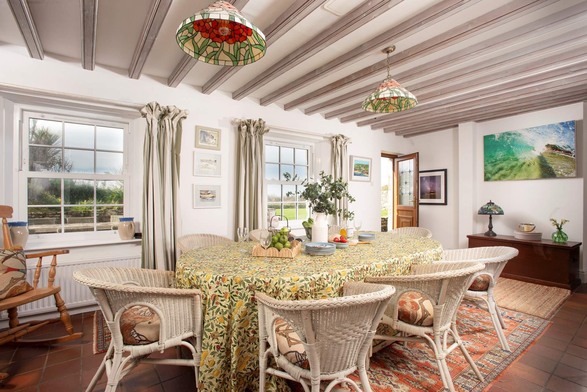 The spacious dining area has access to the front lawn and terrace.