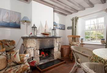 The dining-room boasts an open fire.