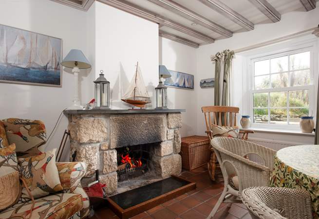 The dining-room boasts an open fire.