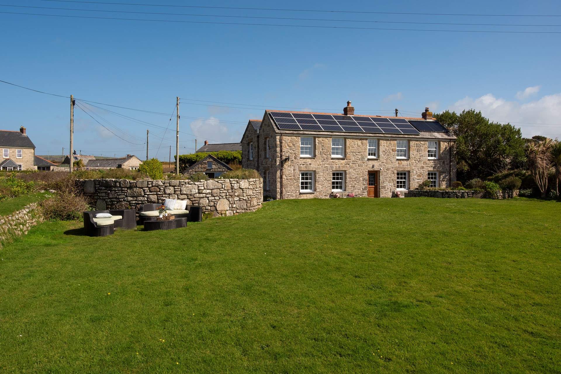 There is an enormous lawn and lounge area with incredible sea views.