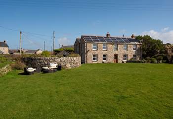 There is an enormous lawn and lounge area with incredible sea views.