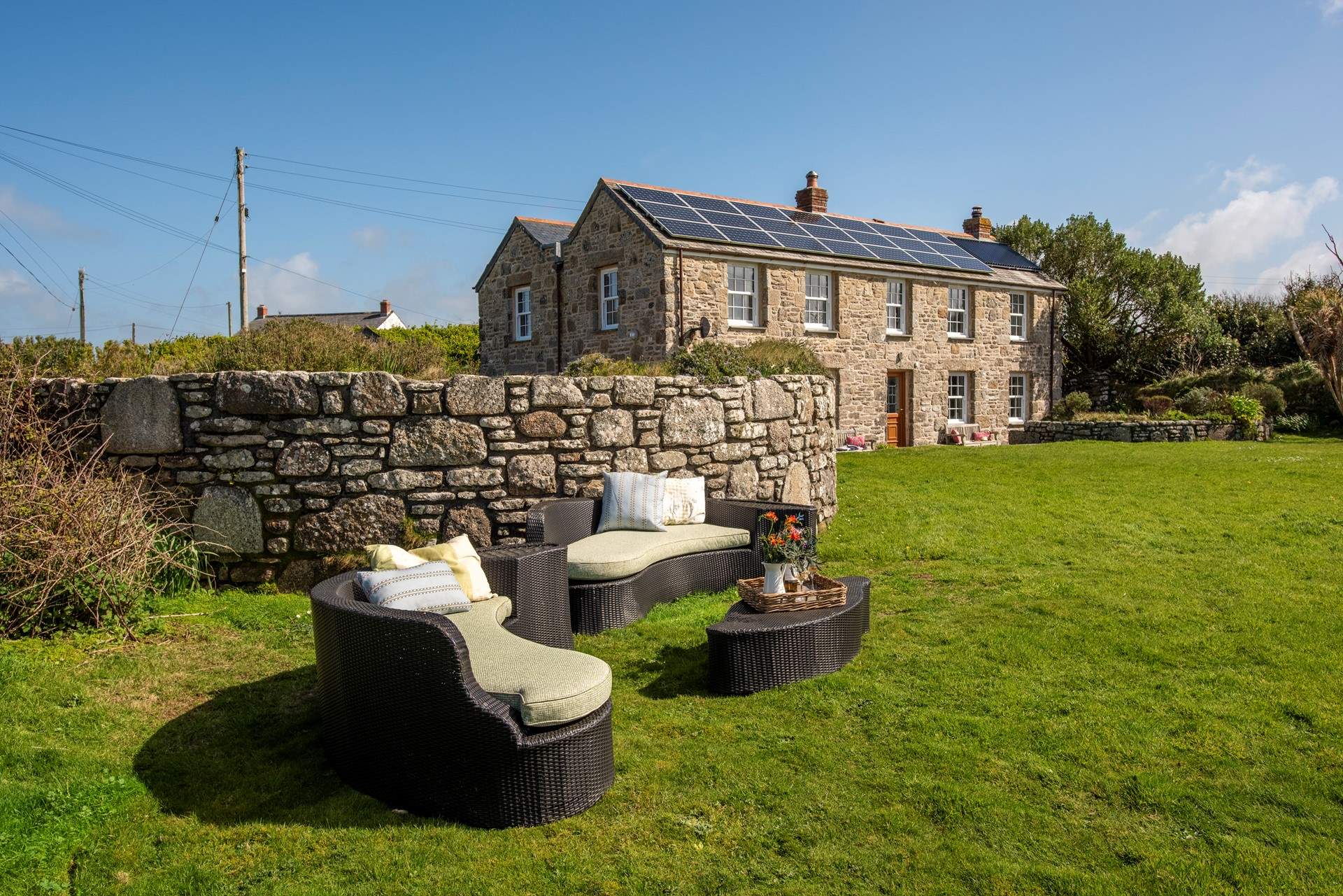 There is a lounge area on the lawn, perfect for picnics looking over the sea.