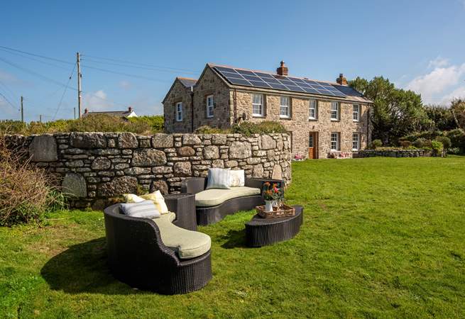 There is a lounge area on the lawn, perfect for picnics looking over the sea.
