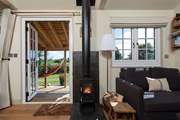 The warming wood-burner ensures year-round cosiness to supplement the underfloor heating.