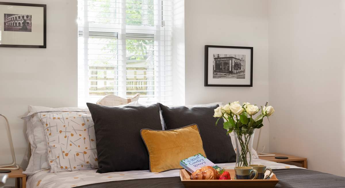 Pretty bedroom has a king-size bed. 