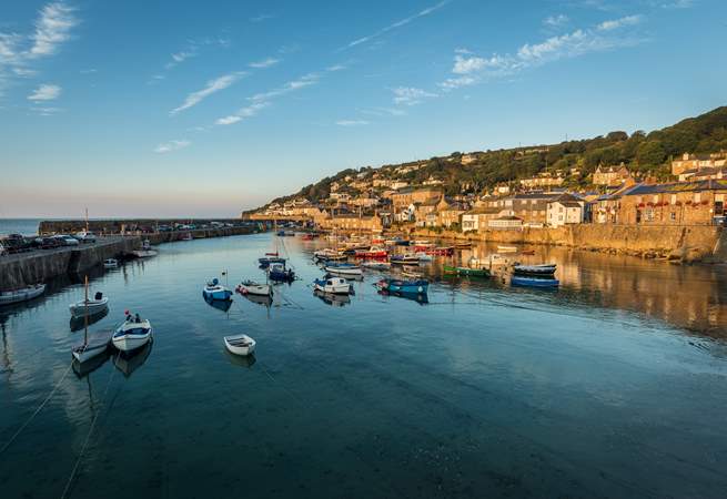 The idyllic seaside village of Mousehole is a short drive away.