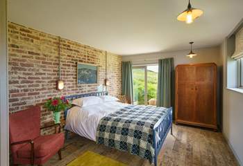 The main bedroom is bright and comfy and boasts a king-size bed with an ensuite. 