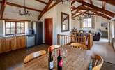 Looking back into the living area from the kitchen and dining area. - Thumbnail Image