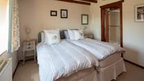 Bedroom 1 comprises of two twin beds located next to each other. Please advise if you would like these beds to be split.
