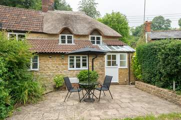 The back of Wayside Cottage is just as pretty as the front and the patio is a real sun-trap.