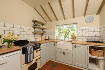 A country-style kitchen with pretty views over the garden.