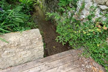 This is the shallow stream running along the far end of the garden, please take care. You can close the little gate in front of the summer-house if you wish to keep this area inaccessible.