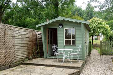 This lovely summer-house is available for your use and looks out over the stream. To the right is the little gate that can be shut. More photographs of this area and the garden will be coming soon!