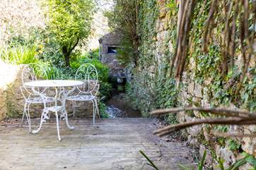 This is the area by the babbling stream. Please do take care in this area; it can be closed off using the little gate next to the summer house.