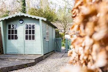 This lovely summer-house is available for your use and looks out over the stream. To the right is the little gate that can be shut.